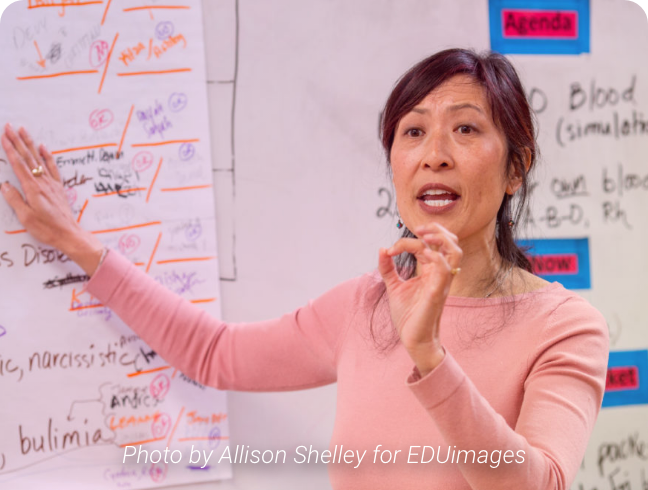 Image of woman at whiteboard